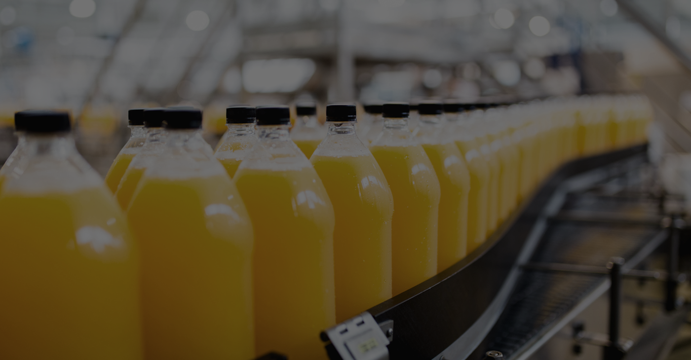 Orange juice bottle in production line